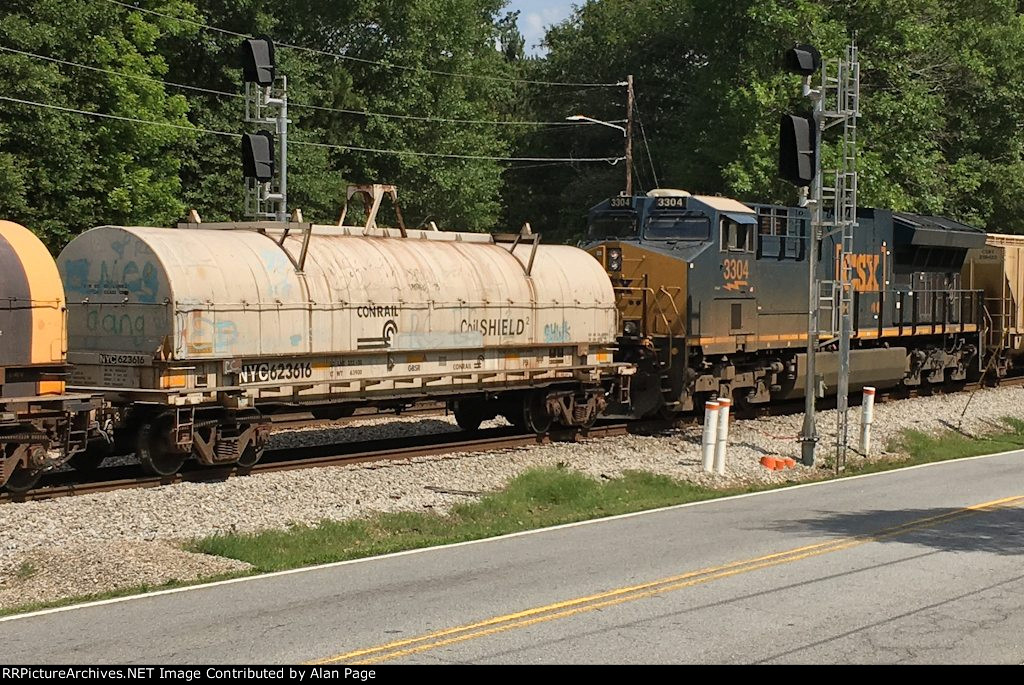 NYC 623616 coil car follows CSX 3304 though the signals